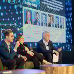 Tom Secaur moderating the panel on the InvestOps stage 