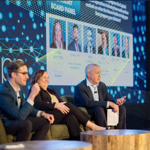 Tom Secaur moderating the panel on the InvestOps stage 