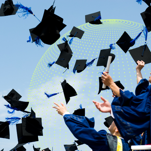 grads throw caps into the air in celebration