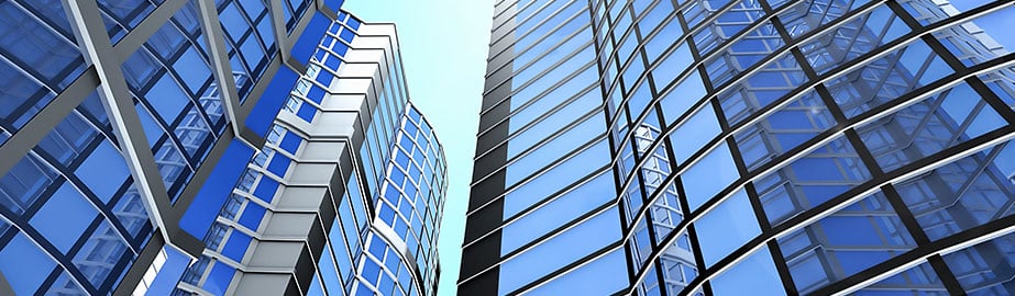 blue buildings in city during daytime with sky in background