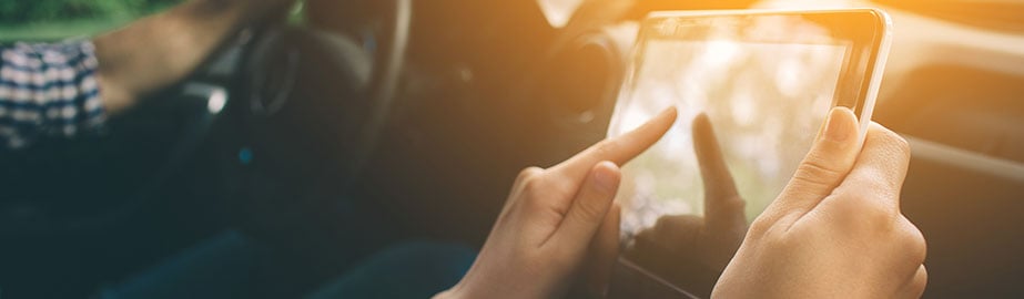 Couple traveling in car using GPS