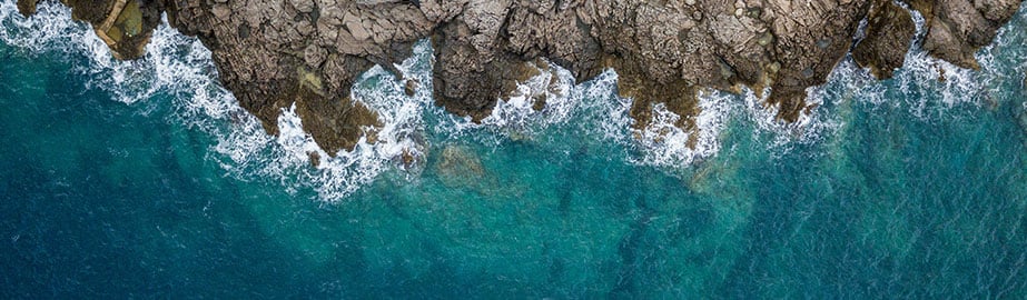 Image of waves lapping upon rocky shore