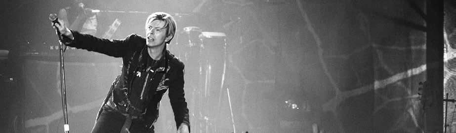 Black and white image of David Bowie performing