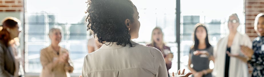 Woman surrounded by group of women